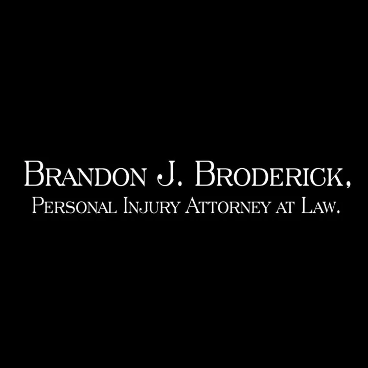 Brandon J. Broderick ad: the firm name in white serif type on a plain black background, nothing else.