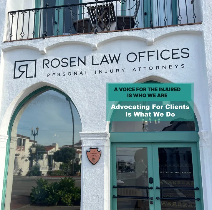 Rosen Law Offices ad: the firm's white Spanish-style office building with 'A voice for the injured is who we are' overlaid.