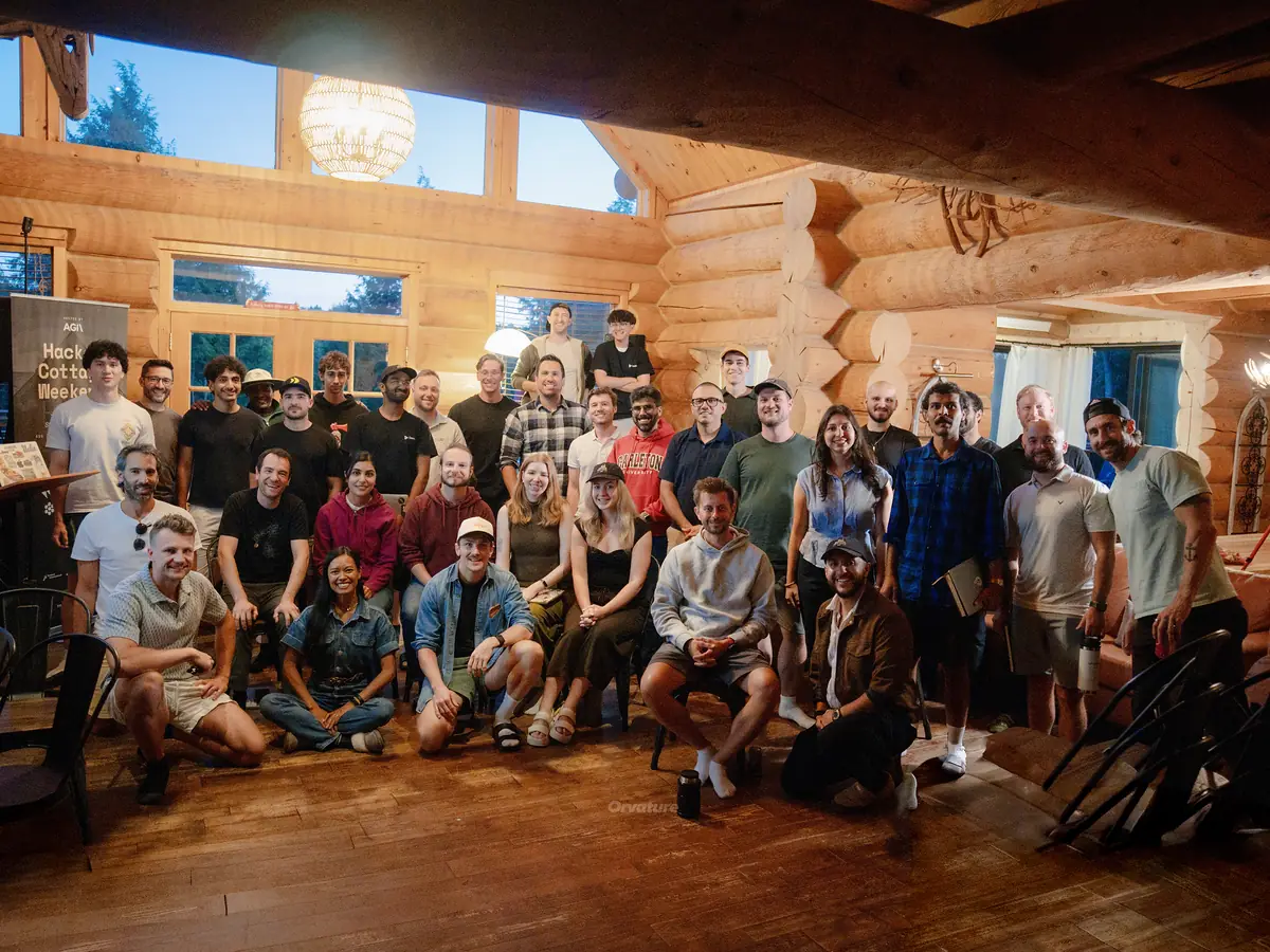 The full group at AGI Ventures Hacker Cottage Weekend in Canada, gathered in a log cabin